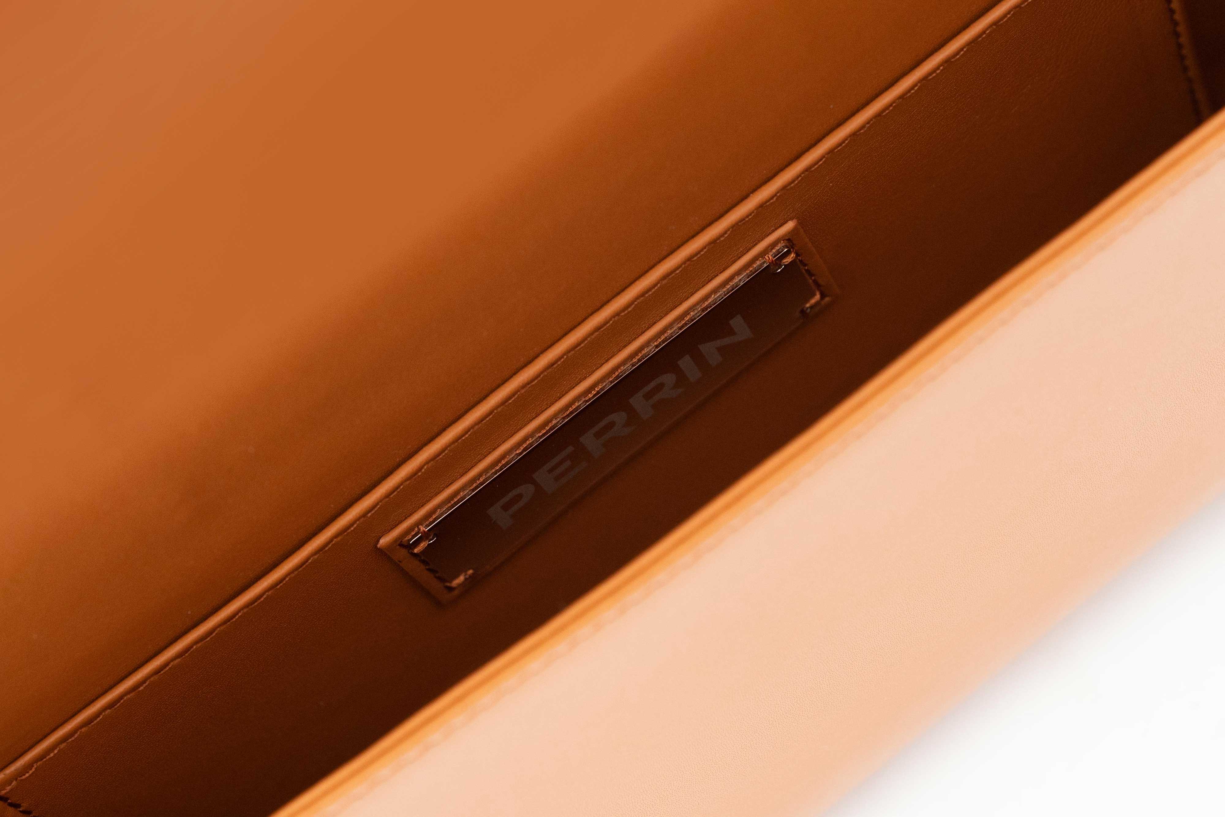 LA CORSETTE LEATHER GLOVE CLUTCH IN CARAMEL WITH ESPRESSO – PERRIN